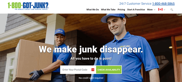 Two employees in blue uniforms from 1-800-GOT-JUNK? carry boxes. Text on image reads, "We make junk disappear. All you have to do is point!" and a postal code entry field is visible.