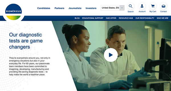 Two medical professionals analyze data on a computer screen in a laboratory setting, with text overlay about diagnostic tests on the website's banner.