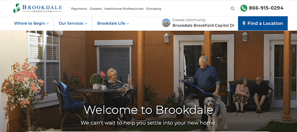 Image depicts an outdoor sitting area at a Brookdale senior living community. Seniors are seated and walking, one with a dog. The scene is welcoming, with text saying, "Welcome to Brookdale.