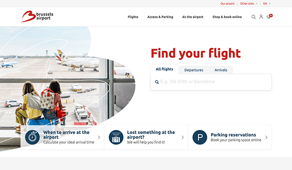 Website interface of brussels airport featuring options like flights, access, parking, shopping, and a search bar; background shows people observing planes on the tarmac.