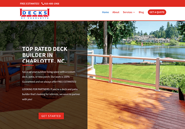 Website homepage for "Decks of Charlotte," showcasing a wooden deck overlooking a lake with trees and houses in the background. The text promotes deck building services and offers a link to get started.