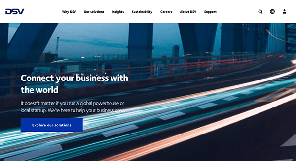 Homepage of DSV website featuring a long exposure photo of a bridge with traffic light trails at night, along with a headline about connecting businesses globally.