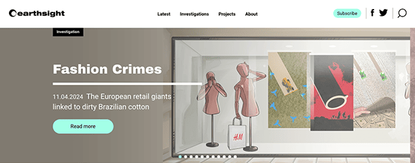 Website header displaying an article titled "fashion crimes" about european retail giants and brazilian cotton, featuring illustrated storefront with mannequins.