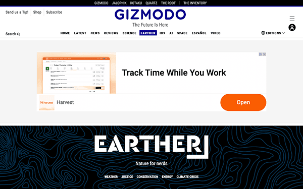 Screenshot of the gizmodo website homepage displaying articles on technology and science with a prominent advertisement for a time tracking app called harvest.