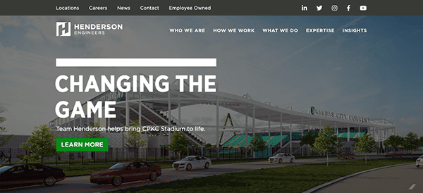 Website homepage for henderson engineers featuring a banner with the text "changing the game" over an image of a large, modern sports stadium.