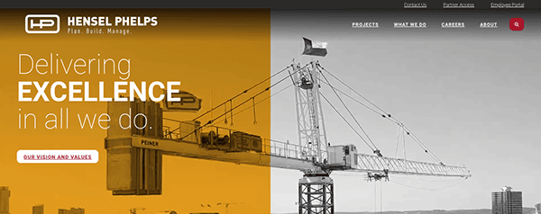 Website banner of hensel phelps featuring a yellow crane on the left and construction of a bridge on the right with the tagline "delivering excellence in all we do.