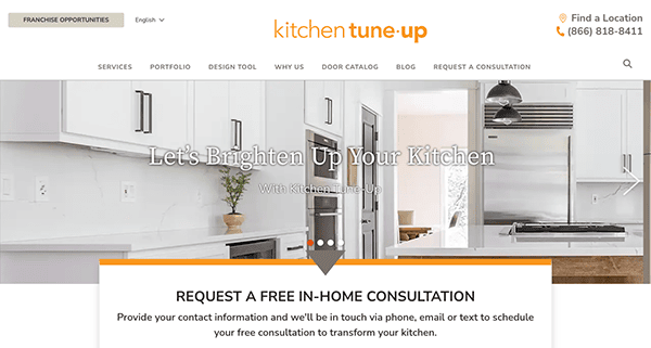 A kitchen remodeling website homepage displaying modern kitchen cabinetry and appliances, with text promoting a free in-home consultation.