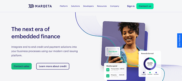 Website homepage design for a financial platform, featuring a smiling woman holding a smartphone with graphical interface elements around her.