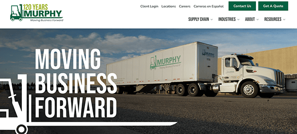 Website banner for Murphy transportation company featuring a white semi-truck with the company's logo, parked under the slogan "Moving Business Forward".