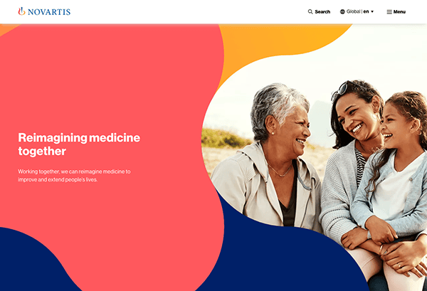 Three joyful women of different generations embracing outdoors on a sunny day, with a colorful graphic and "novartis" logo above text about reimagining medicine.