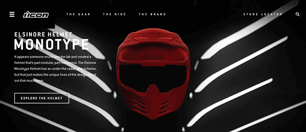 A red motorcycle helmet displayed prominently in the center with the logo "icon" above on a dark, stylized background with white light beams.