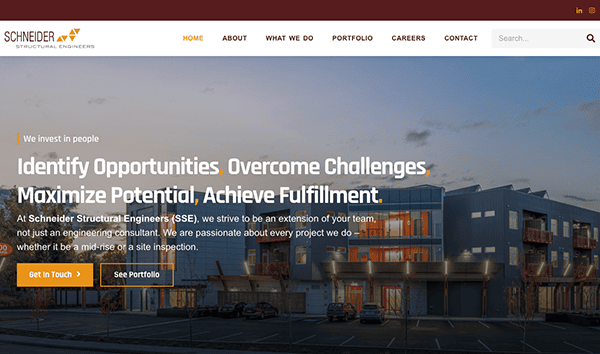 Website homepage of schneider structural engineers featuring a header with navigation links and a large image of an impressive modern building at dusk with overlay text about their mission and a call to action button.