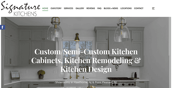 A kitchen showroom webpage with white text over an image of a modern kitchen featuring grey cabinets, gold hardware, and pendant lights. The company name "Signature Kitchens" is displayed at the top.