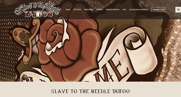 Website header for "slave to the needle tattoo" featuring a stylized tattoo design of a red rose with banner reading "slave to me" in ornate script.