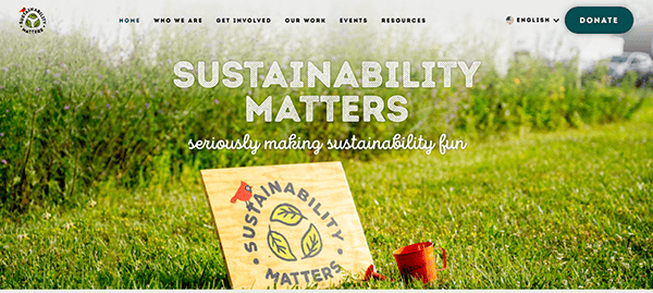 Website banner showing a green grass background with a "sustainability matters" sign, a red watering can, and a slogan: "seriously making sustainability fun.