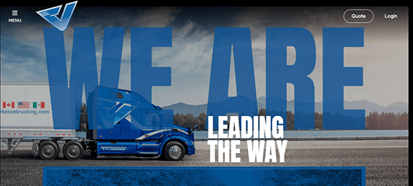 Website banner showing a blue truck with the text "WE ARE LEADING THE WAY" over a scenic background, with website navigation options at the top.