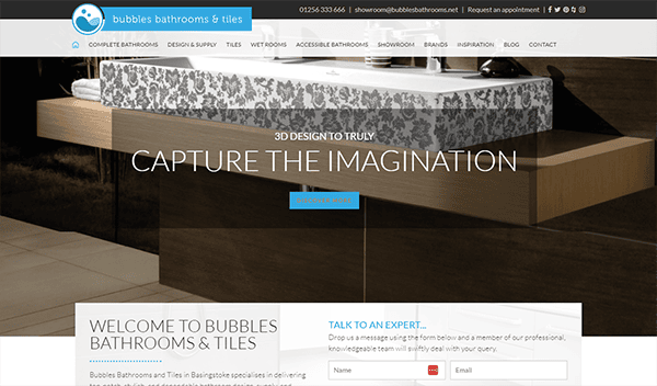A website homepage of Bubbles Bathrooms & Tiles featuring a modern bathroom vanity with a prominent "Capture The Imagination" headline. Navigation and contact details are visible at the top of the page.