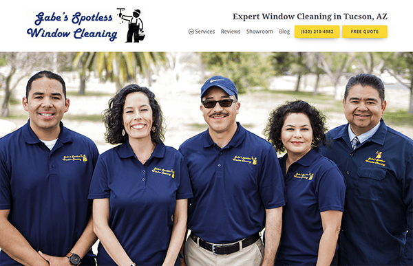 Five people wearing uniforms with "Gabe's Spotless Window Cleaning" logo stand together outdoors, smiling. A banner above them displays the company name, contact number, and a "Free Quote" button.