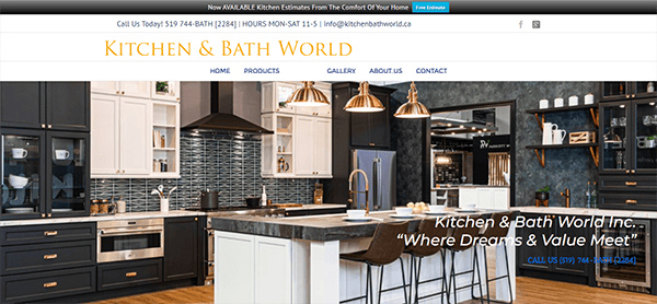 Showroom interior of Kitchen & Bath World featuring modern kitchen designs with cabinets, countertops, and appliances. The website header includes contact information and available kitchen estimate services.