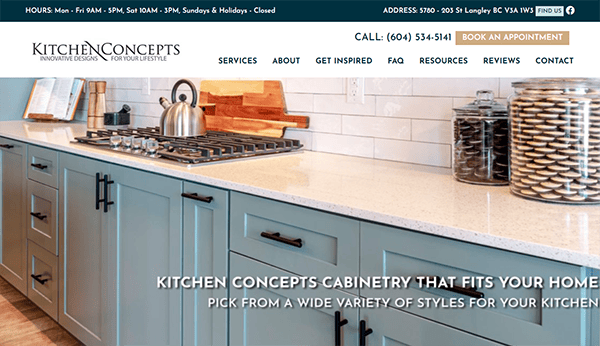 A kitchen showroom display featuring a countertop with a kettle and cutting board, under which there are light blue cabinets. The text promotes Kitchen Concepts cabinetry and provides contact details.