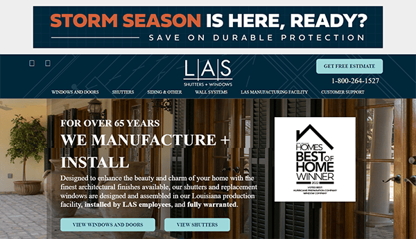 Website homepage for LAS Shutters + Windows showcasing their manufacturing and installation services with a banner about storm season and a "Best of Home Winner" award.