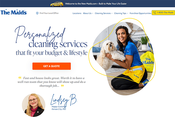 A cleaning service website with a woman in a blue and yellow uniform holding a small white dog. Text promotes personalized cleaning services with a quote from a customer, Lindsey B. Contact number is visible.