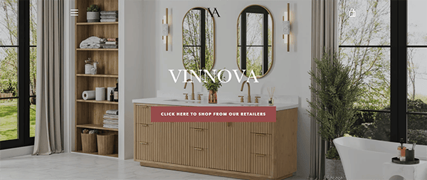 Modern bathroom with double sink vanity, arched mirrors, and brass fixtures. Large windows provide natural light. Shelving unit on the left and a freestanding bathtub on the right.