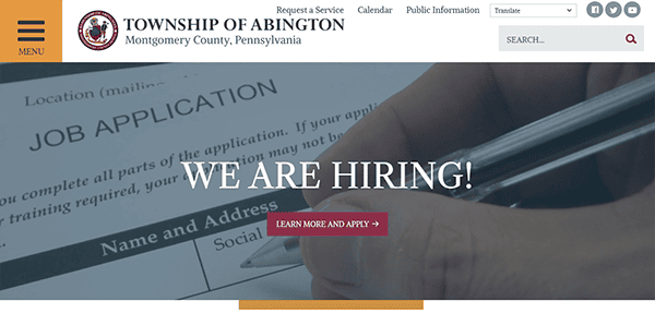 A webpage from the Township of Abington, Montgomery County, Pennsylvania, featuring a prominent "WE ARE HIRING!" banner overlaid on an image of a job application form.