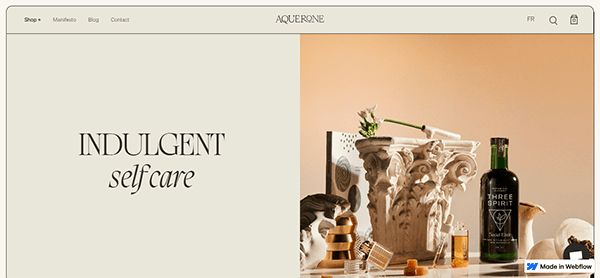 A website banner with the words "INDULGENT self care" on the left and a decorative display featuring a bottle of Three Spirit, a statue, and various self-care items on the right—perfectly styled like one of the 20 Best CBD Website Designs.