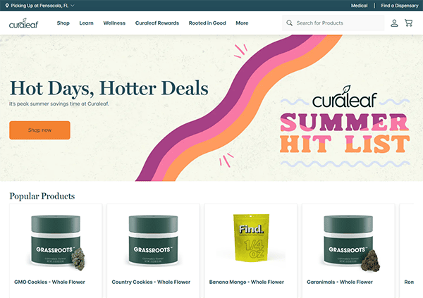 A webpage with a banner stating "Hot Days, Hotter Deals" and "Summer Hit List." Features shopping buttons and images of cannabis products including GMO Cookies, Country Cookies, Banana Mango, and Garanimals.