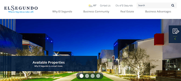 Night view of a modern business complex with illuminated buildings, trees, and walkways. The highlighted section reads "Available Properties. Why El Segundo is a smart move.