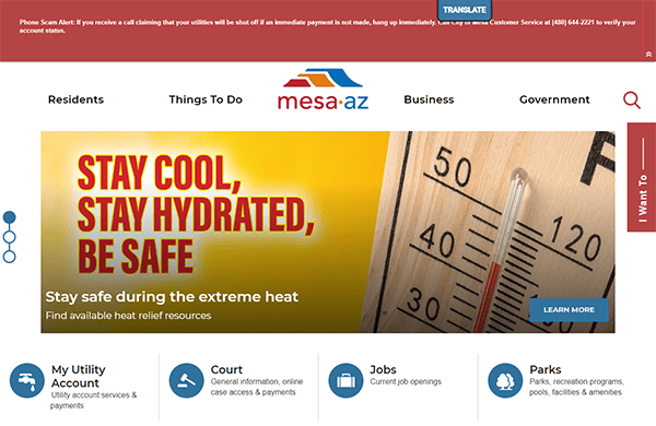 Mesa, AZ website homepage with a banner advising staying hydrated during extreme heat. Navigation links for Residents, Things To Do, Business, and Government are visible along with various service options.