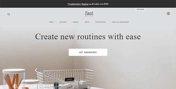 Screenshot of a website homepage with a neutral design. The headline reads, "Create new routines with ease" above a button labeled "Get Organized." Navigation links and a complimentary shipping banner are visible.