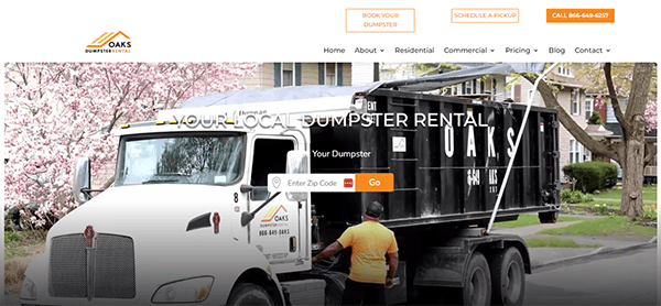 A person in an orange vest stands near a large black dumpster with "OAKS" written on it, which is attached to a white truck on a residential street. The image, featured on a website offering dumpster rental services, showcases sleek website design elements that emphasize professionalism.