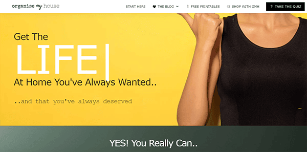 Website homepage with a yellow backdrop, the text "Get The LIFE At Home You've Always Wanted and that you've always deserved". A person in a black tank top points upwards. Various menu options at the top.