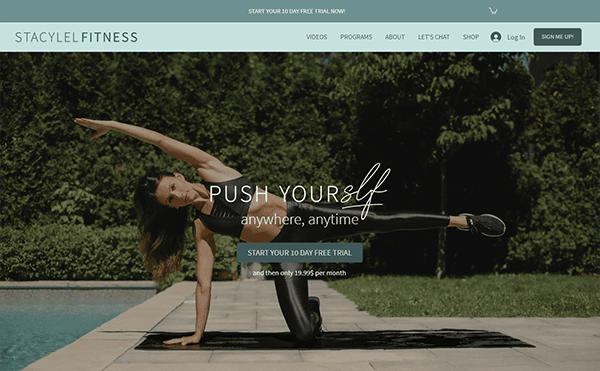 A woman in athletic wear performs a side plank exercise by a pool. The text reads, "Push yourself anywhere, anytime. Start your 7-day free trial." Website header includes navigation links and signup options.