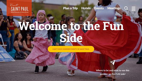 Two girls in colorful dresses dance at an outdoor event. Text overlay reads "Welcome to the Fun Side," promoting summer events in Saint Paul. People are gathered in the background watching the performance.