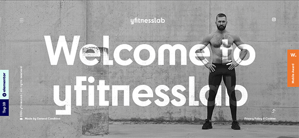 A man in fitness attire stands against a concrete wall with text overlay: "Welcome to yfitnesslab." Various menu options and website elements are visible.