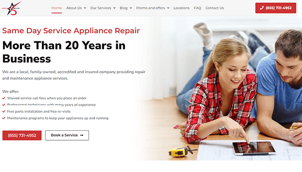 A couple uses a tablet to book appliance repair services on a website advertising over 20 years of business, same-day service, and various offerings. The page has contact information and navigation links.