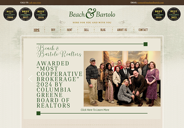 Beach & Bartolo Realtors proudly showcases an award announcement from 2024 by the Columbia Greene Board of Realtors. Displayed on one of the best realtor websites, it features a group photo of the beaming team.