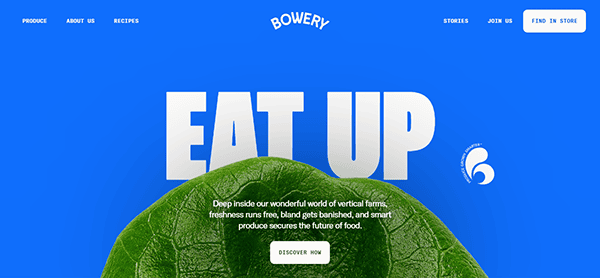 Screenshot of a website homepage with a blue background and the words "Eat Up" in large letters above a green leaf. There is navigation text at the top, and a description with a "Discover Now" button.