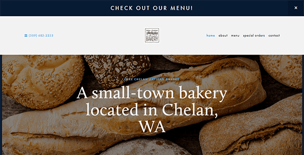 Website homepage of a small-town bakery located in Chelan, WA, featuring various types of bread in the background and navigation links for contact information, menu, special orders, and more.