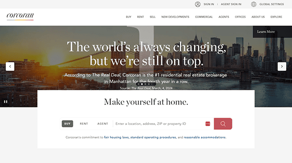 Website homepage of a real estate agency featuring a Manhattan skyline background, tagline "The world’s always changing, but we’re still on top," and a search bar for buy, rent, or agent.