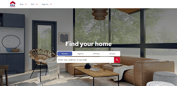 A modern living room with large windows and minimalist furniture. The website screen displays a search bar for finding homes by city, address, or zip code.