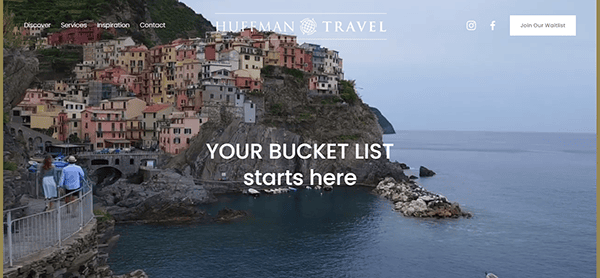 A coastal village with colorful buildings on a steep cliffside by the sea, with "Hueman Travel" text at the top and "Your Bucket List starts here" in the center. Social media icons and a button on the right.