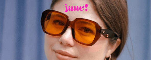 Person with brown hair wearing large, orange-tinted sunglasses. The name "jane!" is written in pink text above the person's head.