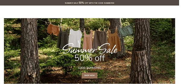 Clothing hung on a clothesline among trees with text overlaying the image: "Summer Sale 50% off with code SUMMER50. Shop Now.