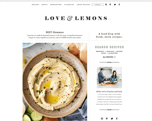 A webpage titled "LOVE & LEMONS" featuring a hummus recipe with an image of creamy hummus in a bowl. To the right, there is a section to search recipes and a small photo of two individuals with a greeting.