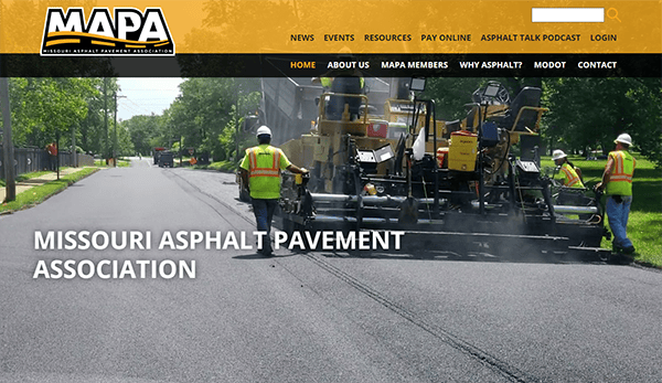 Workers pave a road with asphalt machinery under the Missouri Asphalt Pavement Association banner.