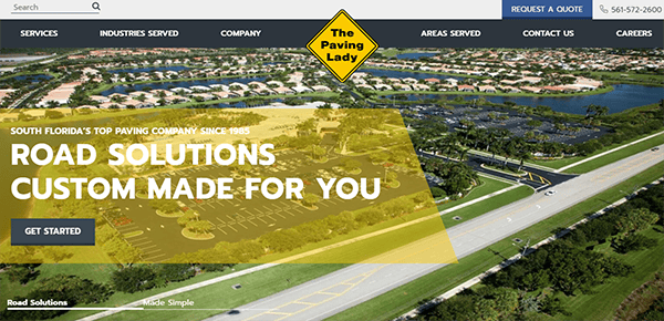 Screenshot of a paving company's website header with a yellow diamond logo reading "The Paving Lady". Text on image promotes "Road Solutions Custom Made For You" with an option to "Get Started".